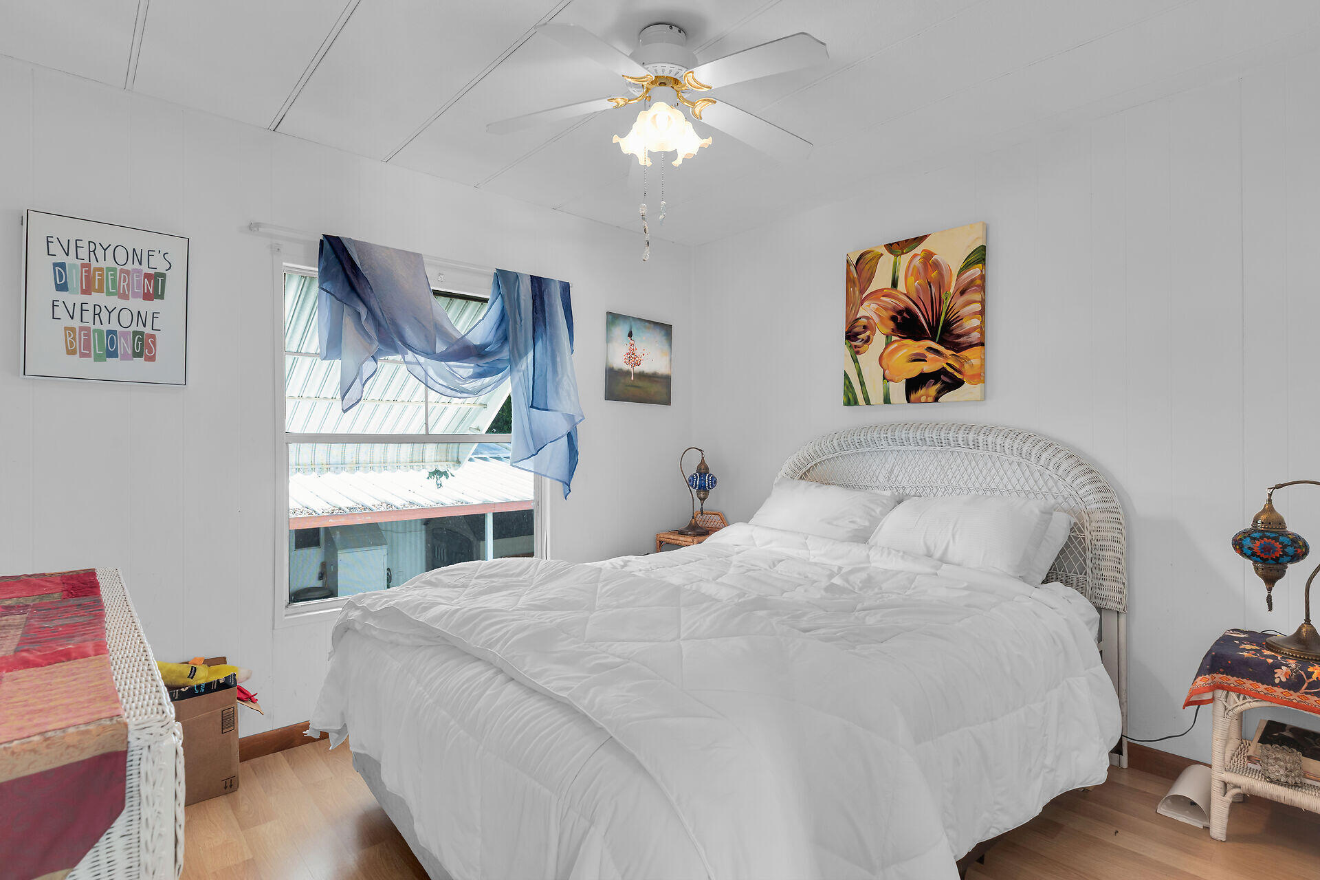 606 North Silver Circle Key Largo, FL 33037 - Photo 30 of 54 a bedroom with a bed and a chandelier