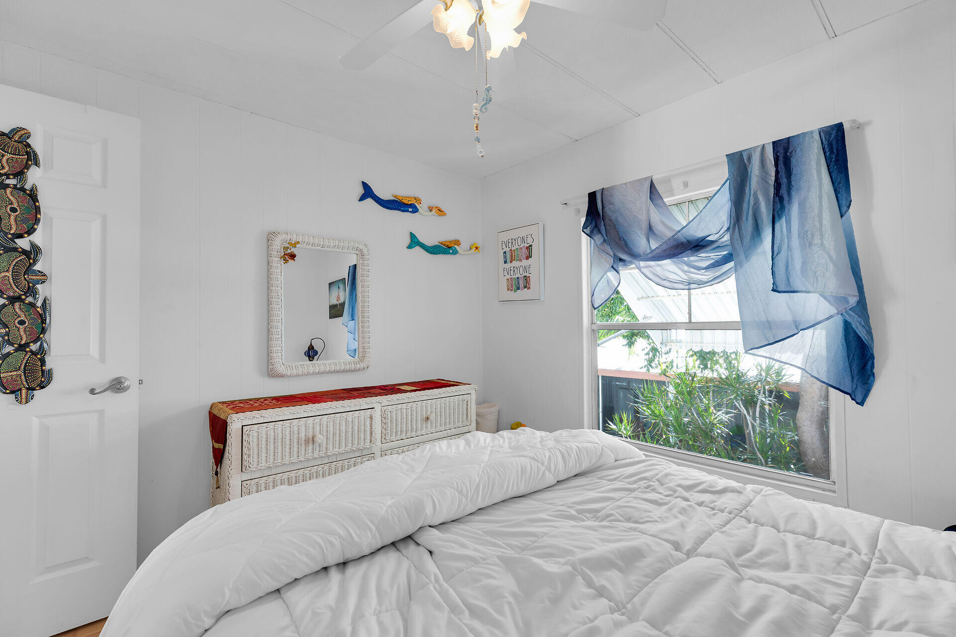 606 North Silver Circle Key Largo, FL 33037 - Photo 31 of 54 a bedroom with a bed and a chandelier