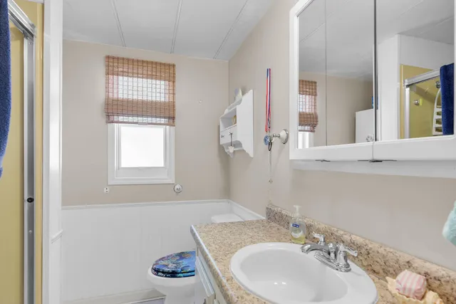 a room with furniture a rug and a book shelf