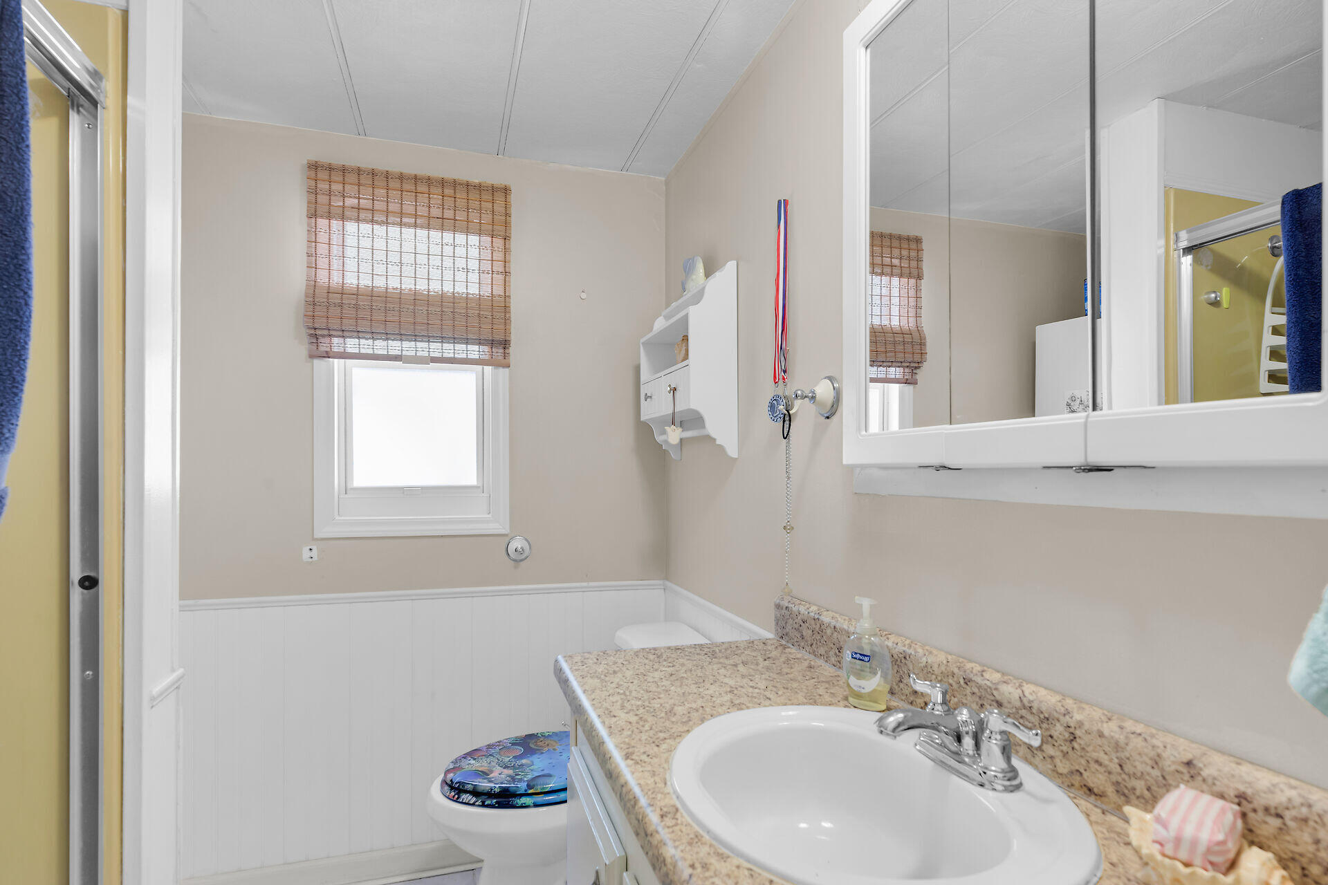 606 North Silver Circle Key Largo, FL 33037 - Photo 33 of 54 a bathroom with a granite countertop sink and a mirror