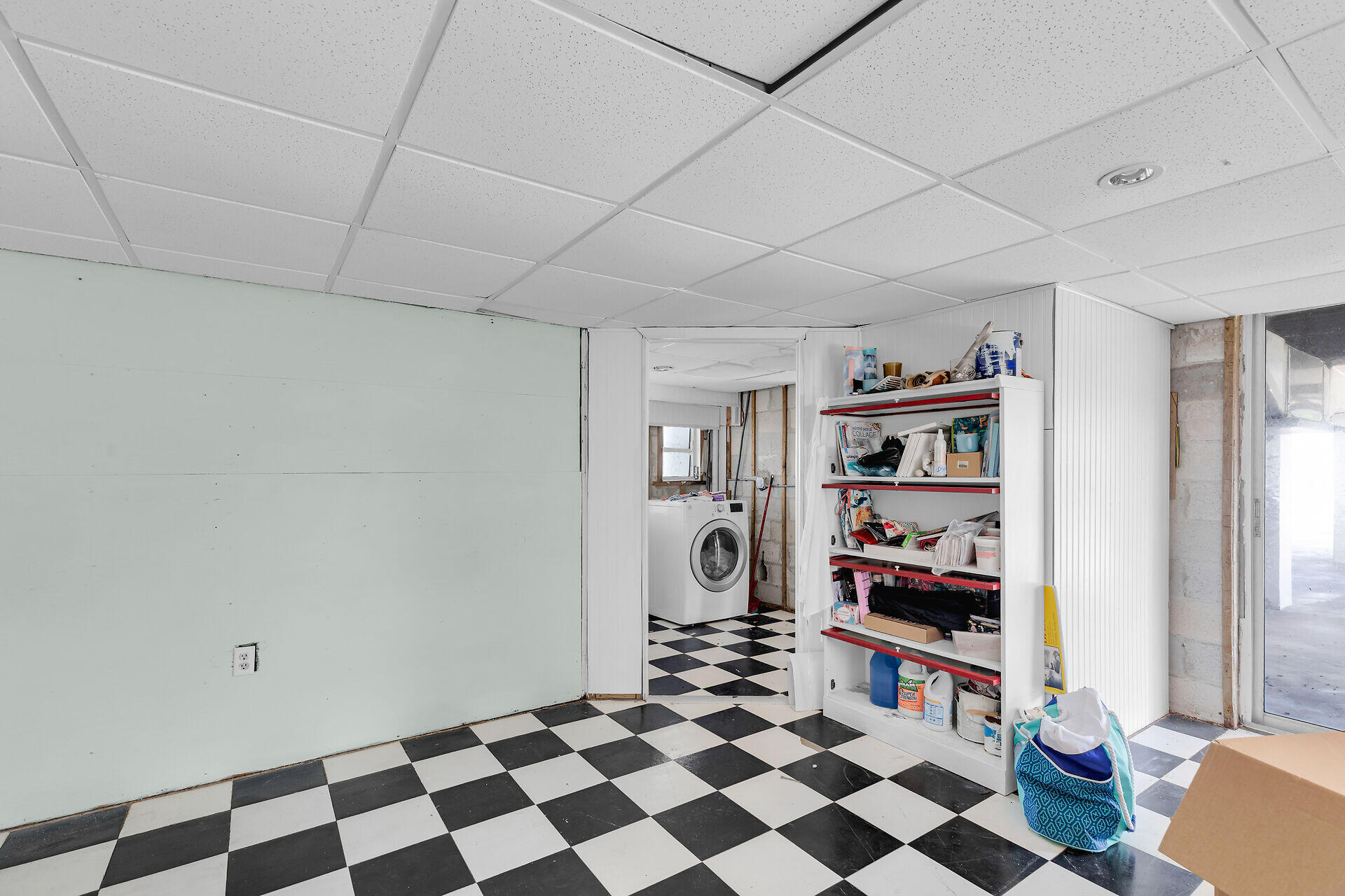 606 North Silver Circle Key Largo, FL 33037 - Photo 36 of 54 a room with furniture a rug and a book shelf