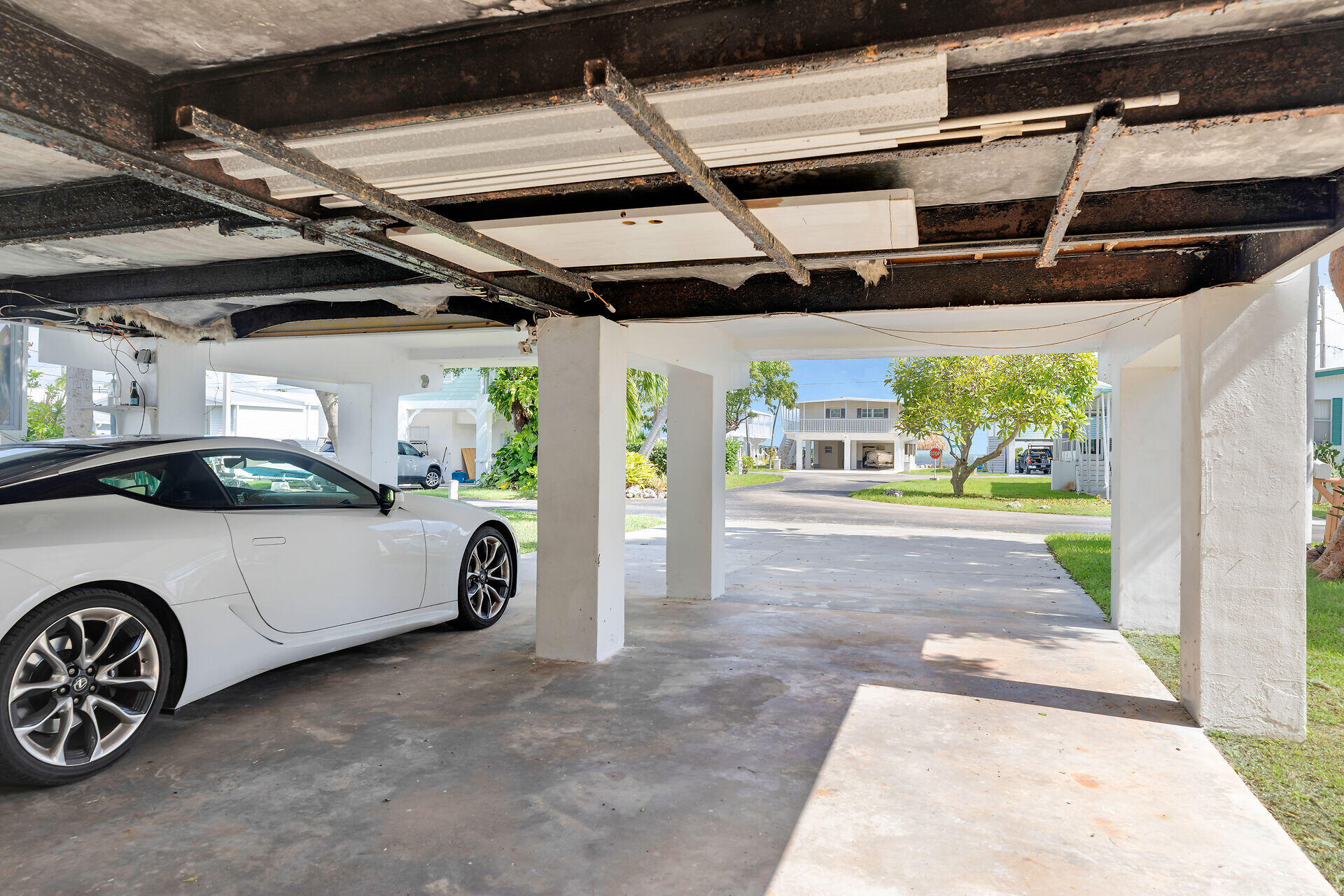 606 North Silver Circle Key Largo, FL 33037 - Photo 39 of 54 a view of garage with a car parked in it