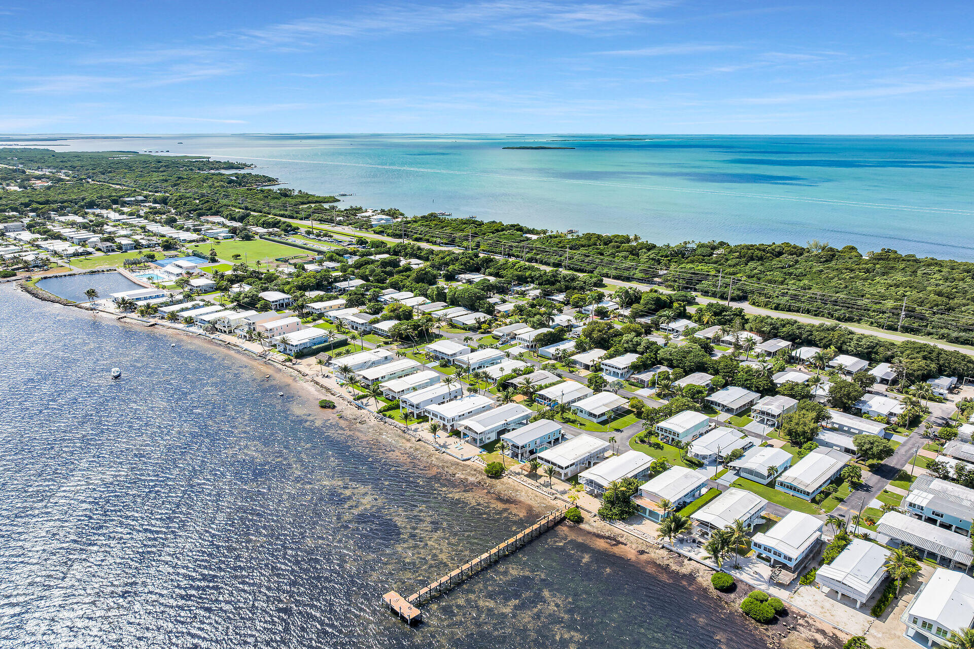 606 North Silver Circle Key Largo, FL 33037 - Photo 4 of 54 a view of a city with ocean view