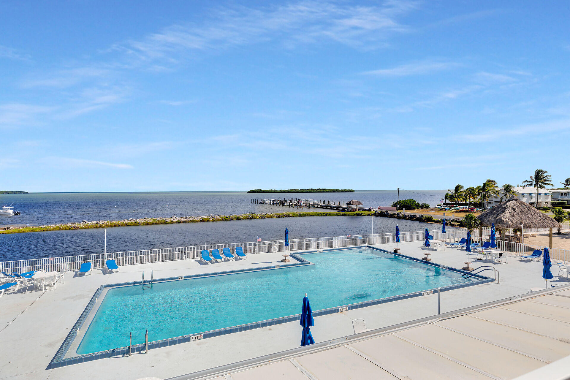 606 North Silver Circle Key Largo, FL 33037 - Photo 49 of 54 a view of swimming pool with seating area and ocean view