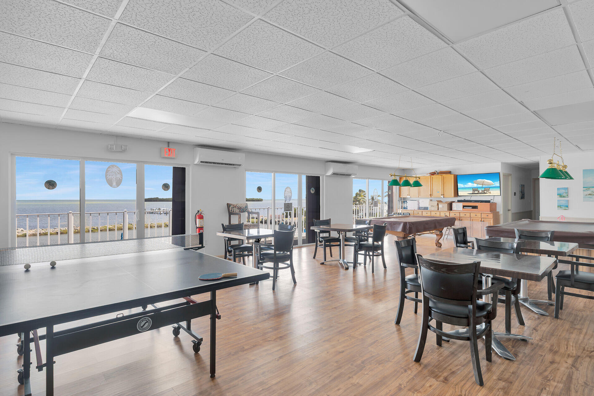 606 North Silver Circle Key Largo, FL 33037 - Photo 50 of 54 a living room with furniture a table and chairs