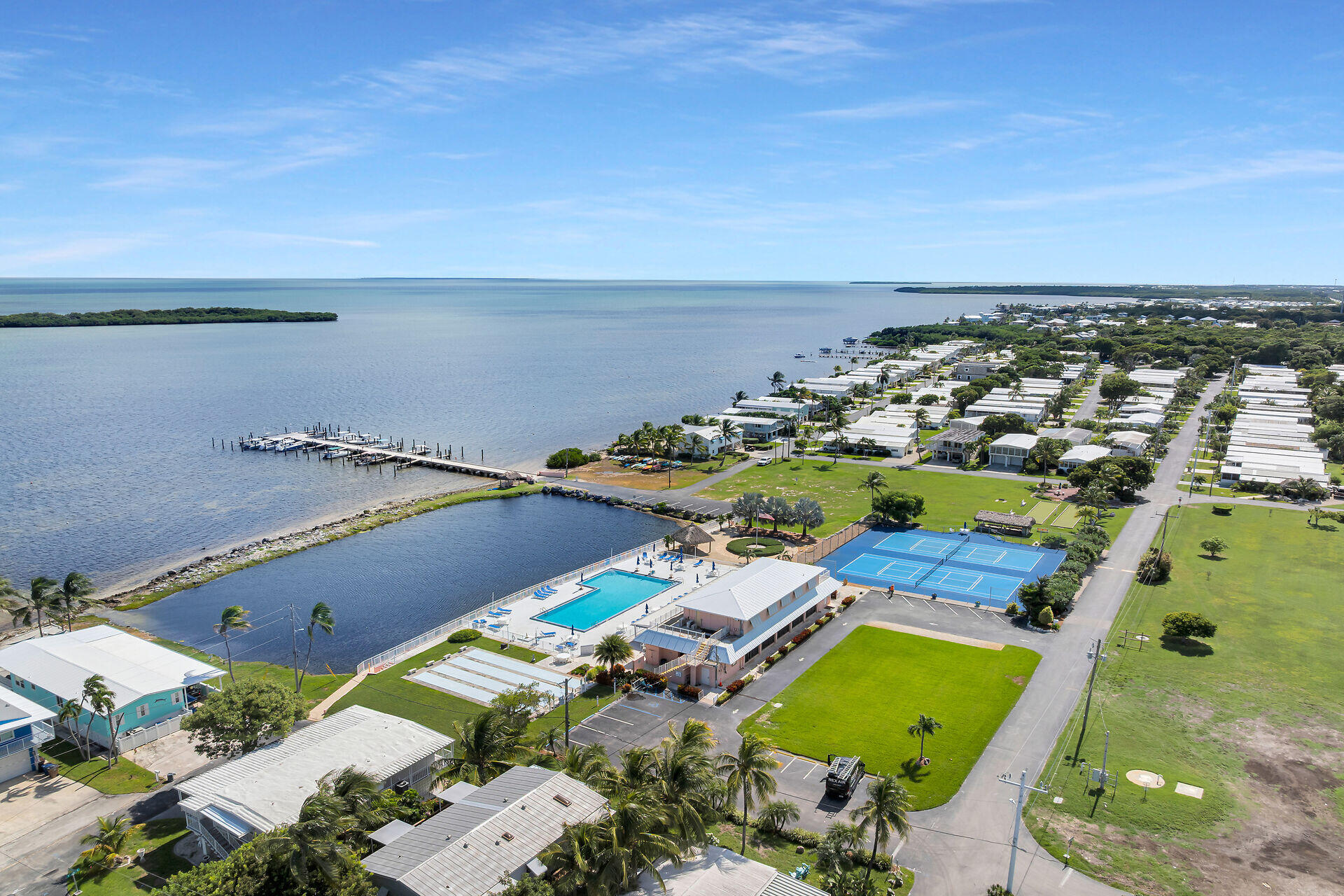 606 North Silver Circle Key Largo, FL 33037 - Photo 9 of 54 an aerial view of a house with a swimming pool an outdoor seating