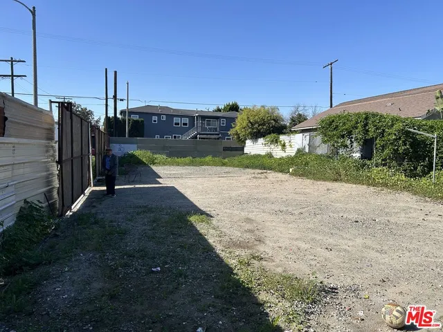 a view of a street in front of a house