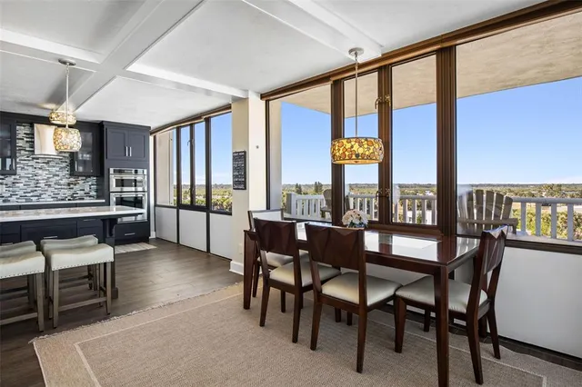 a kitchen with a sink a stove and cabinets