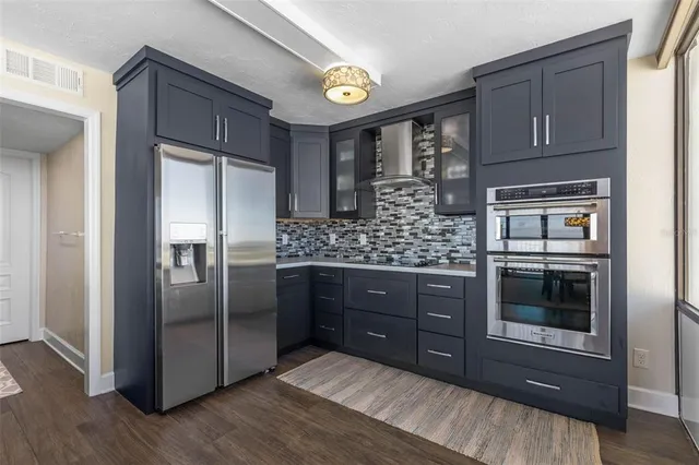 a very nice looking dining room with a large window