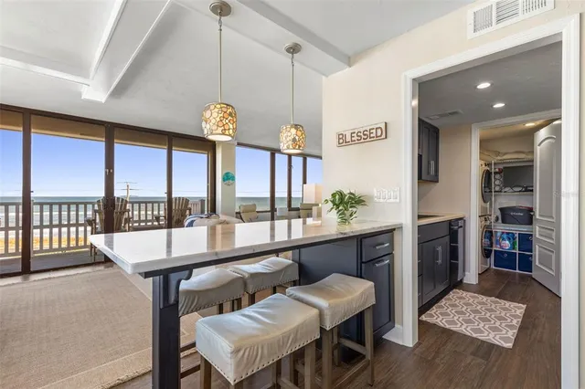a view of a chairs and table in patio