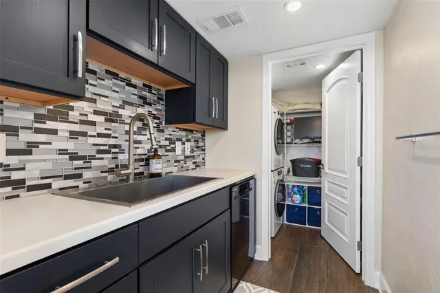 a view of a hallway with wooden floor and windows