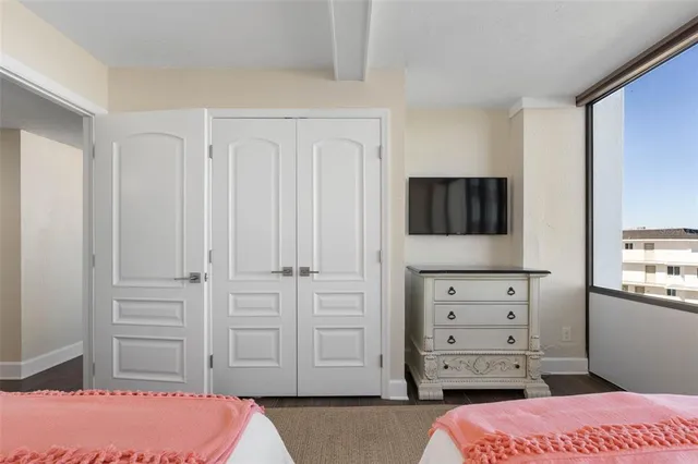 a room with gym equipment and a large window