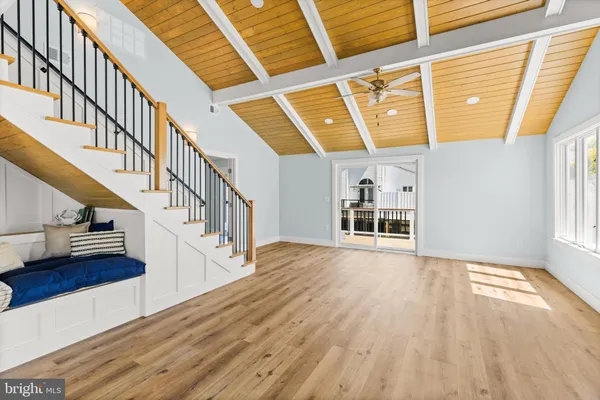 a view of an entryway with wooden floor