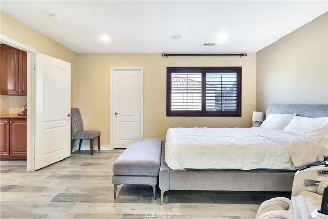 a bedroom with a bed and a table