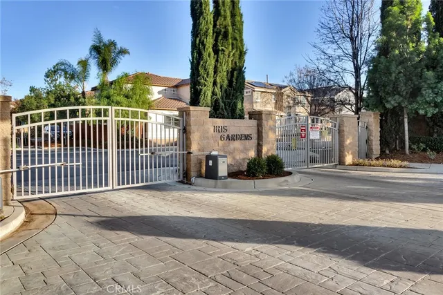a view of a brick building next to a yard