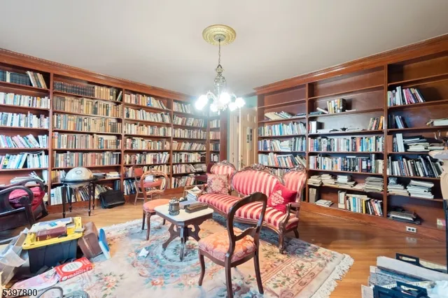 a workspace with furniture and book shelf