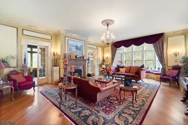 a living room with furniture or couch and a large window