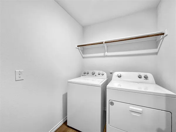 a view of storage room with washer and dryer