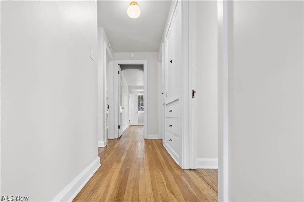 3145 Huntington Road Shaker Heights, OH 44120 - Photo 16 of 28 Hallway featuring warm wood-finish flooring and light-toned walls