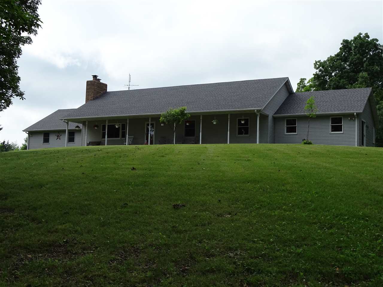 6652 North Cedar Road Forreston, IL 61030 - Photo 1 of 25 a front view of a house with a yard