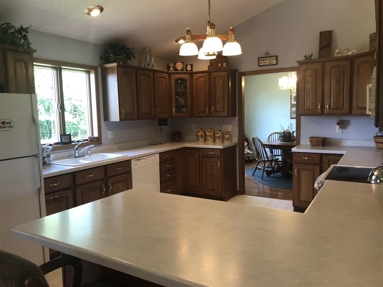 6652 North Cedar Road Forreston, IL 61030 - Photo 5 of 25 a kitchen with a table chairs sink and cabinets