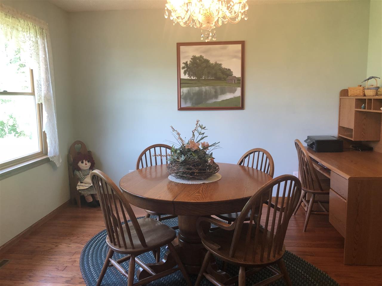 6652 North Cedar Road Forreston, IL 61030 - Photo 6 of 25 a view of a dining room with furniture window and wooden floor