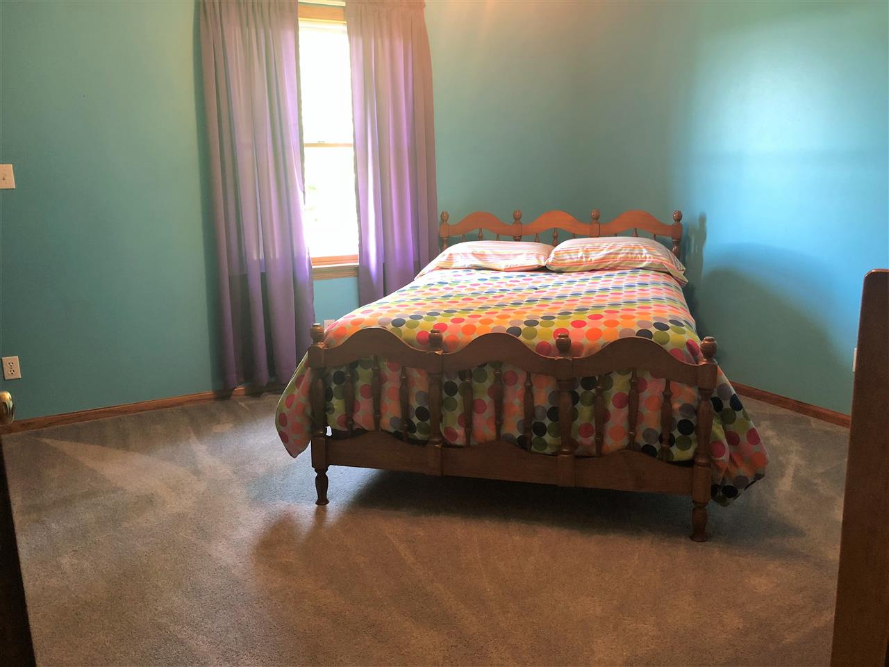 6652 North Cedar Road Forreston, IL 61030 - Photo 10 of 25 a bedroom with a bed and a window