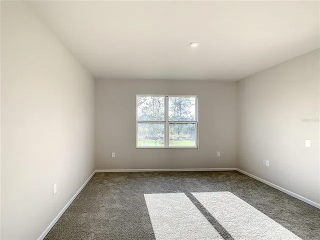 an empty room with a empty space and window