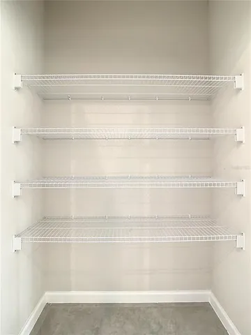 a view of a room that has a large window