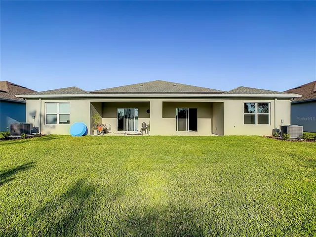 an aerial view of ocean with residential house