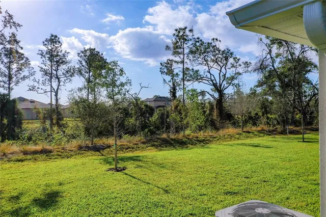 an aerial view of a house with swimming pool