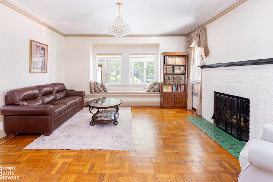 1917 Glenwood Road Brooklyn, NY 11230 - Photo 3 of 22 a living room with furniture and a fireplace