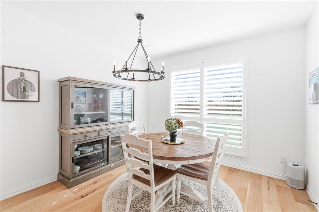 2171 Cloverfern Way Haslet, TX 76052 - Photo 11 of 38 a view of a dining room with furniture and wooden floor