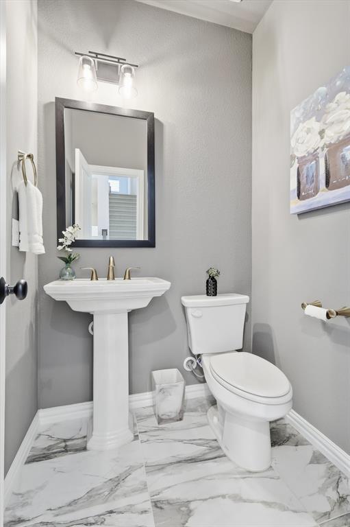2171 Cloverfern Way Haslet, TX 76052 - Photo 13 of 38 a bathroom with a toilet sink and mirror
