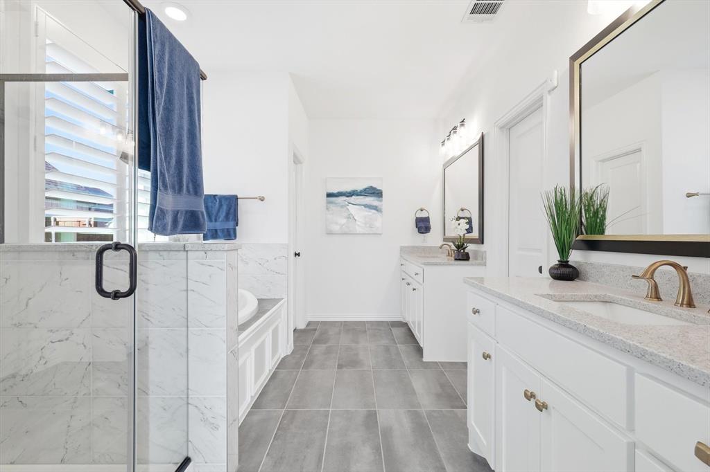 2171 Cloverfern Way Haslet, TX 76052 - Photo 16 of 38 a en suite bathroom with a double vanity sink a mirror and shower