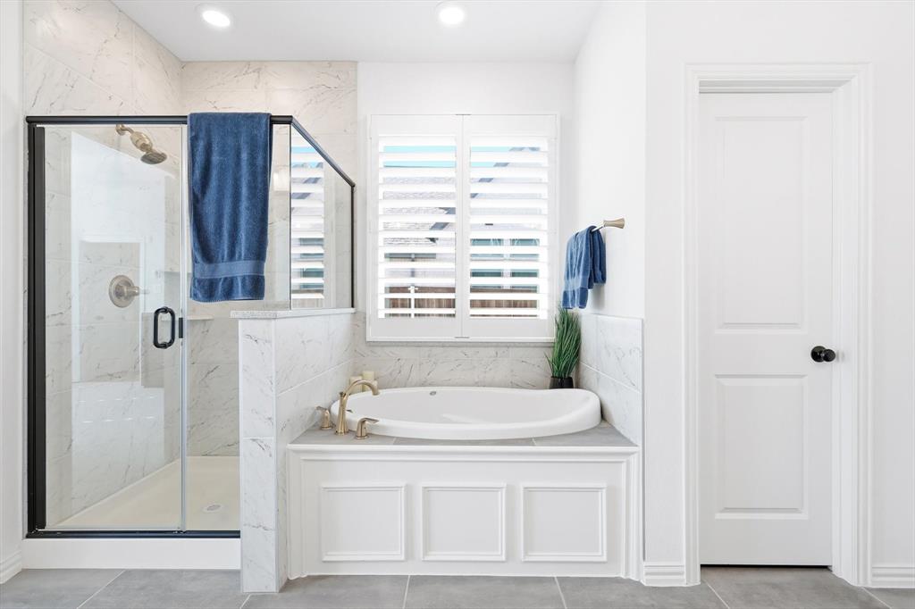 2171 Cloverfern Way Haslet, TX 76052 - Photo 18 of 38 a bathroom with a bathtub and a shower