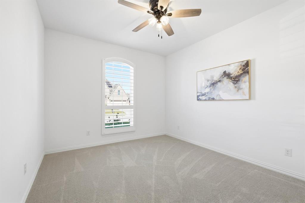 2171 Cloverfern Way Haslet, TX 76052 - Photo 31 of 38 an empty room with windows and fan