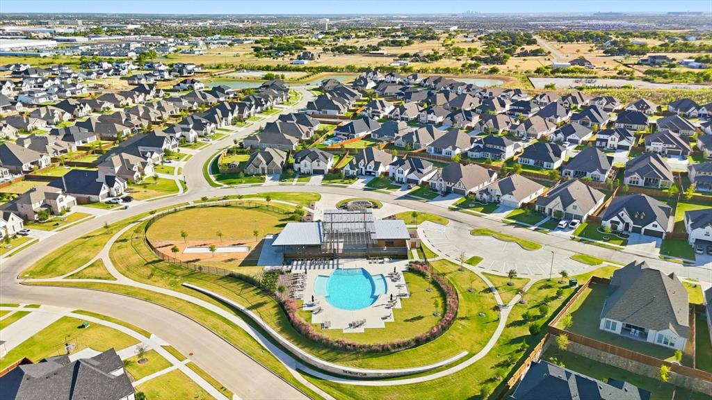 2171 Cloverfern Way Haslet, TX 76052 - Photo 38 of 38 an aerial view of a swimming pool with a table and chairs