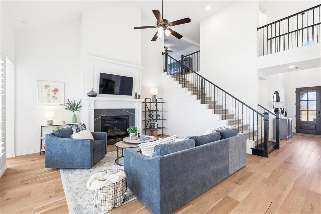 2171 Cloverfern Way Haslet, TX 76052 - Photo 5 of 38 a living room with furniture and a fireplace