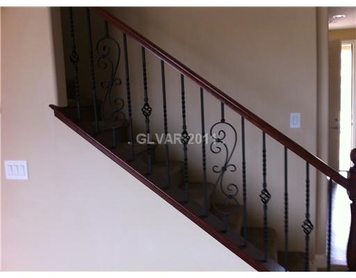 7116 Boomer Beach Street Las Vegas, NV 89166 - Photo 15 of 21 Other. Cherry/Iron Stairrailing