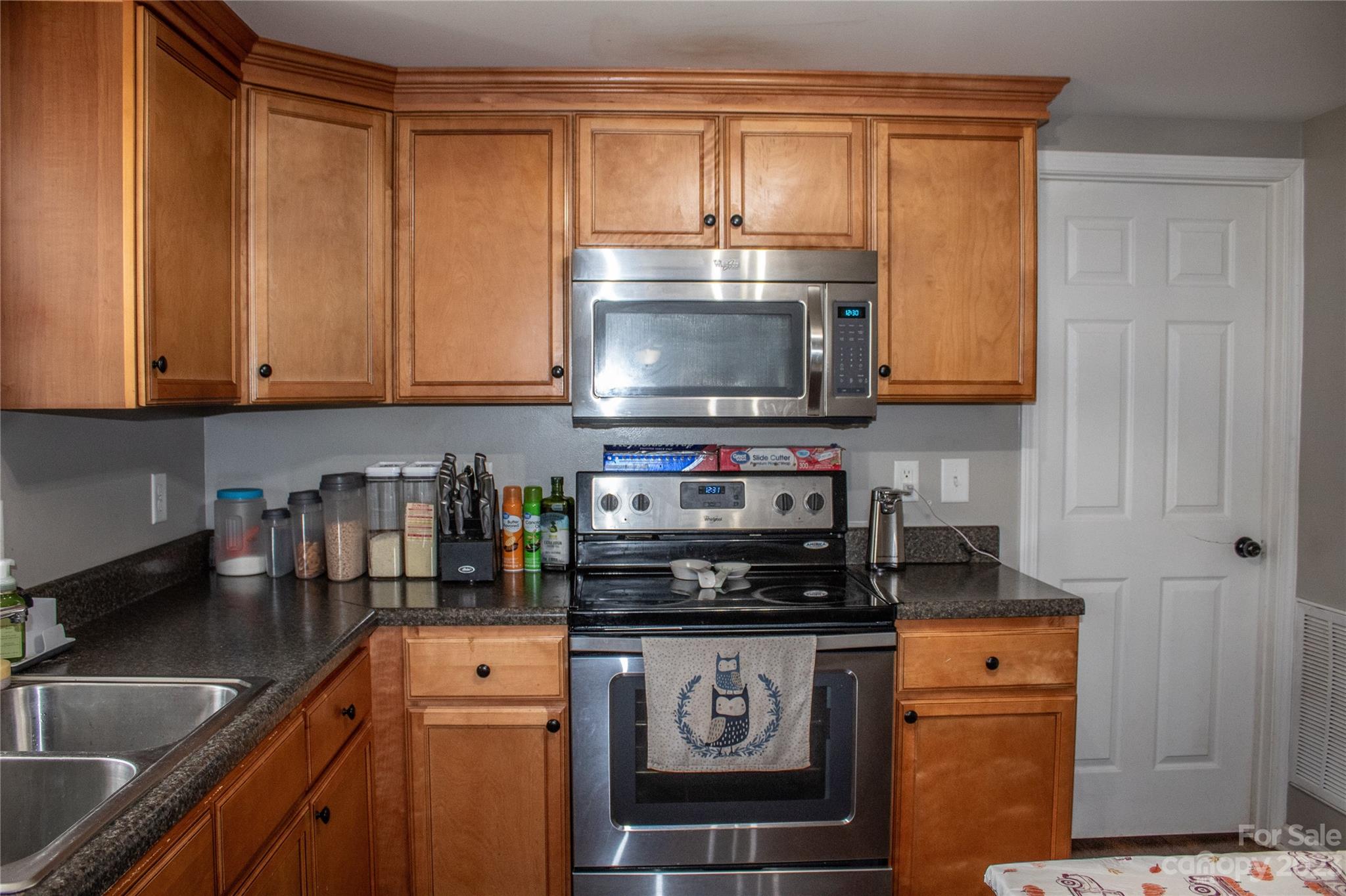 644 St James Church Road Newton, NC 28658 - Photo 8 of 11 a kitchen with stainless steel appliances granite countertop a stove a sink and a microwave