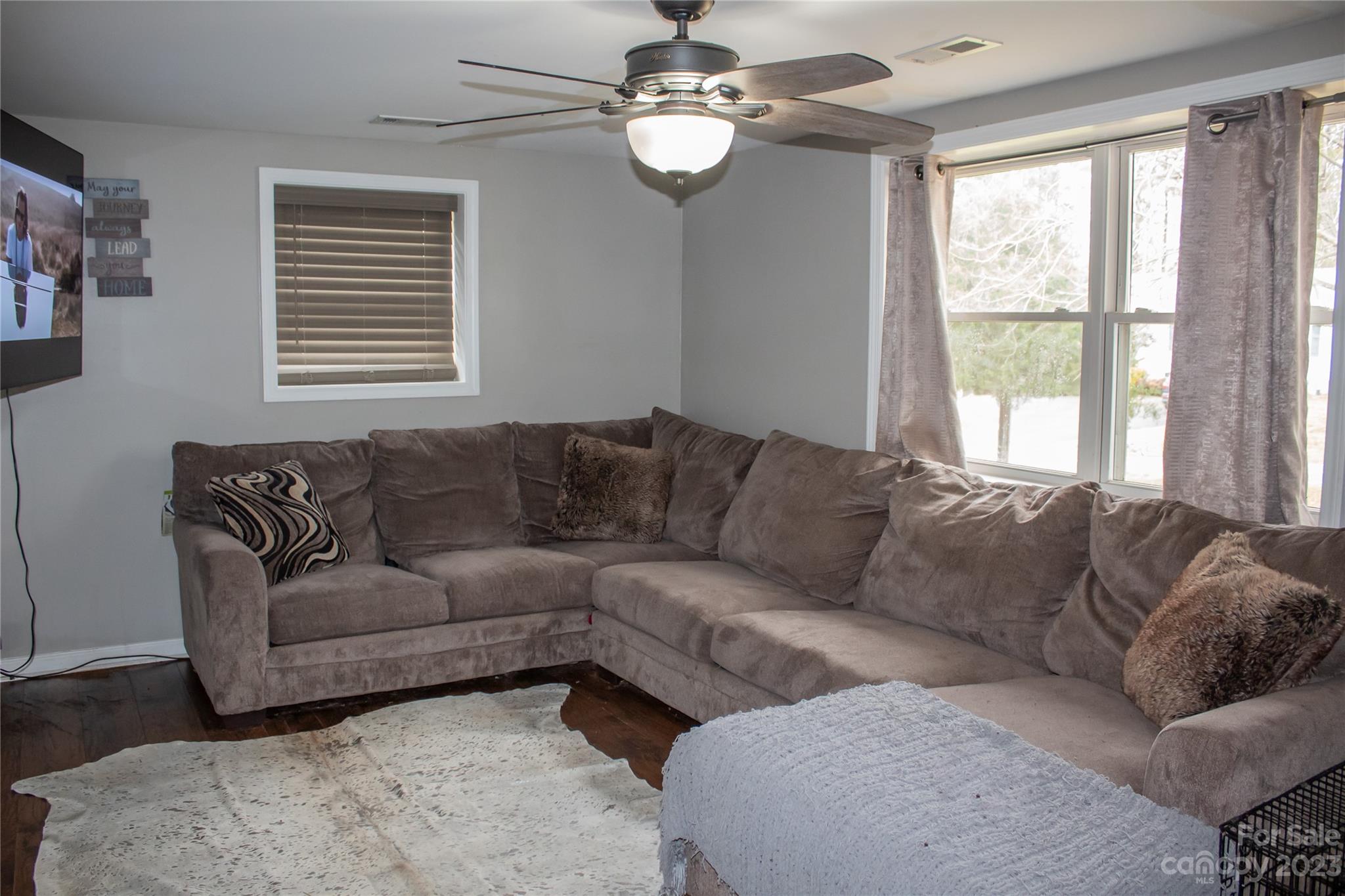 644 St James Church Road Newton, NC 28658 - Photo 9 of 11 a living room with a couch and a chandelier