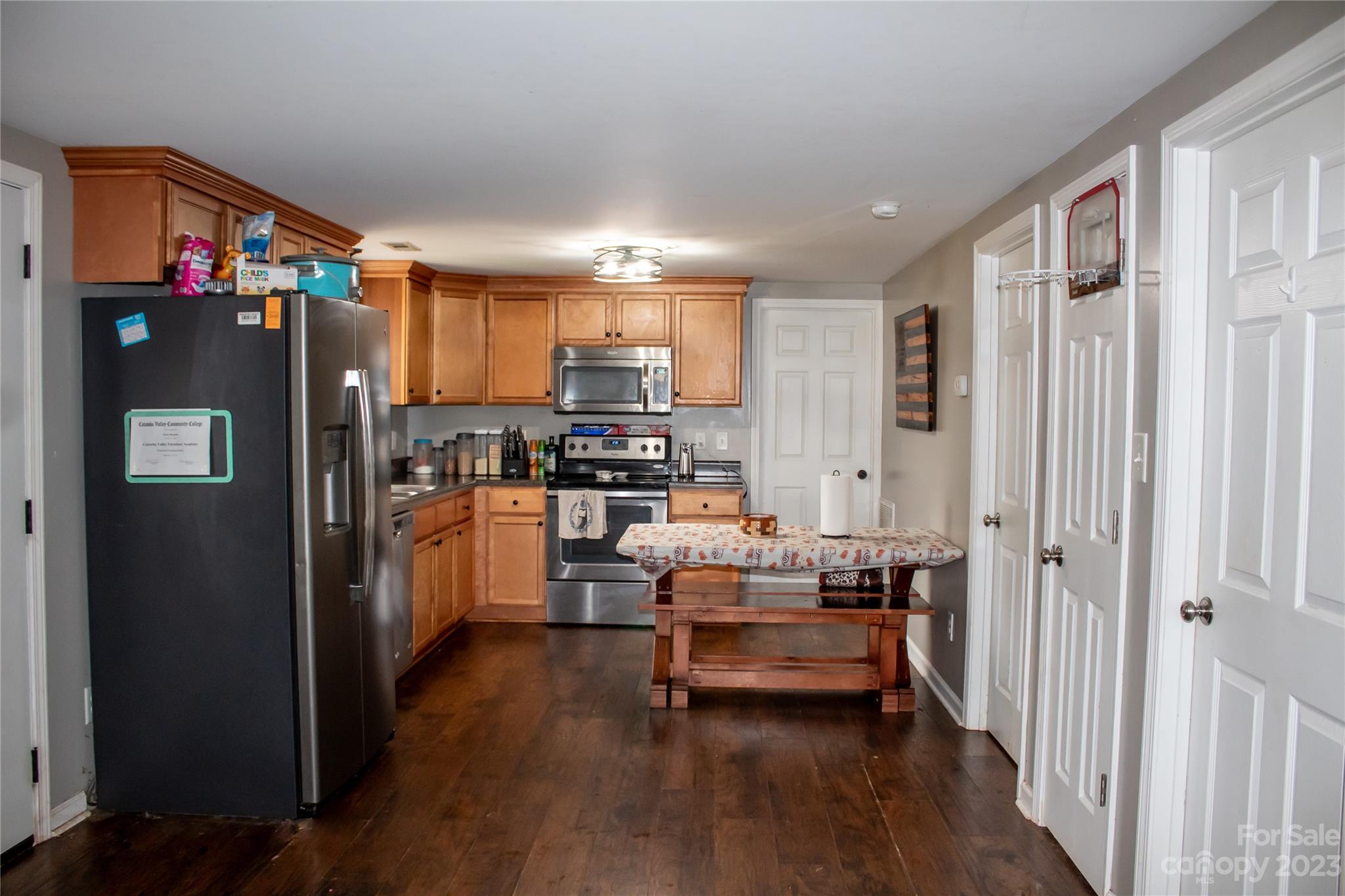 644 St James Church Road Newton, NC 28658 - Photo 10 of 11 a kitchen with stainless steel appliances a refrigerator and a stove top oven