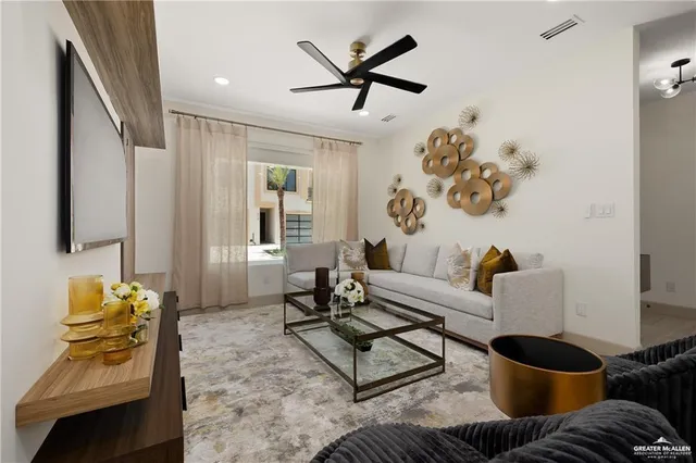 a living room with furniture and wooden floor