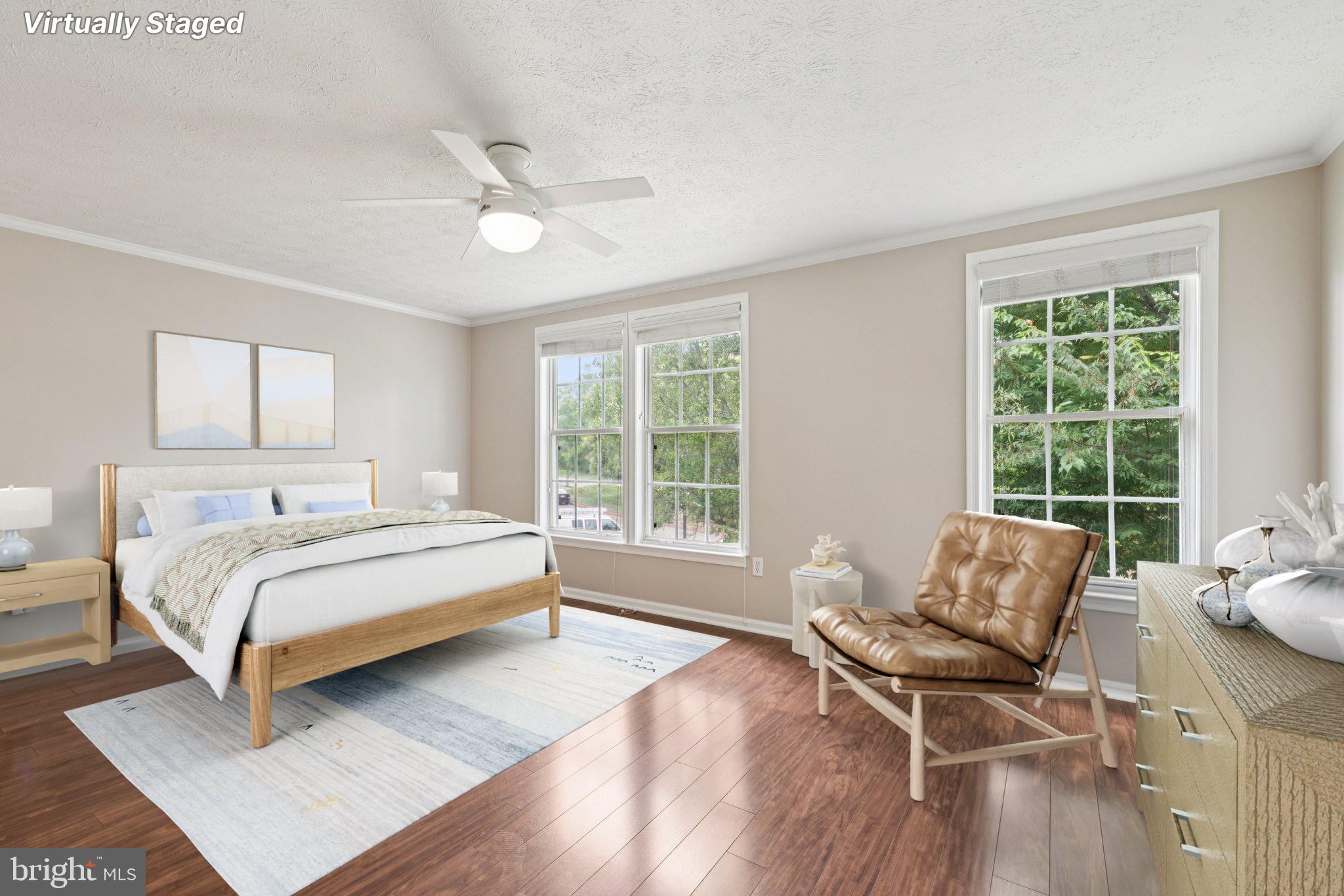 7813 Paddock Way Windsor Mill, MD 21244 - Photo 11 of 30 a bedroom with a bed and wooden floor