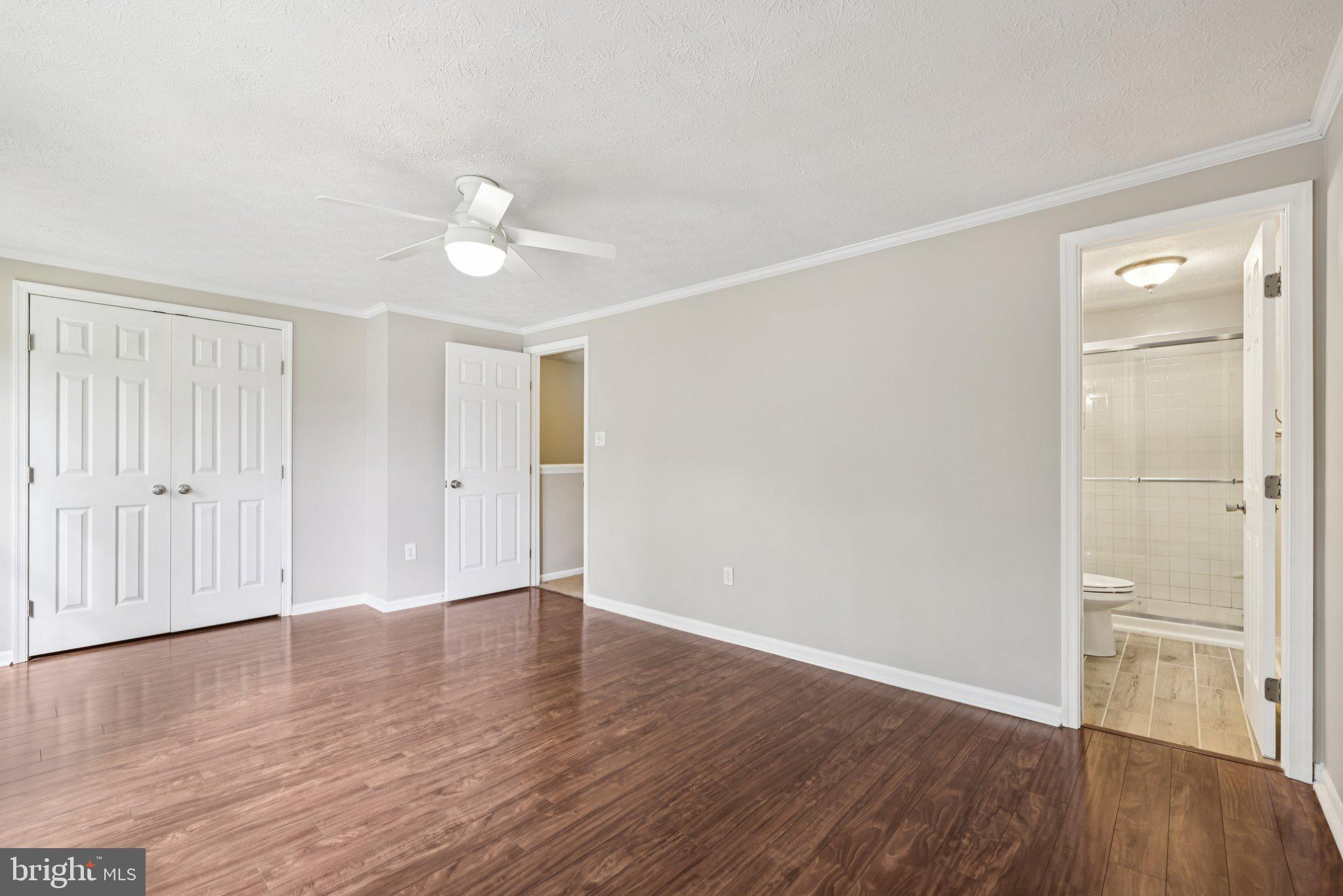 7813 Paddock Way Windsor Mill, MD 21244 - Photo 13 of 30 a view of an empty room with wooden floor