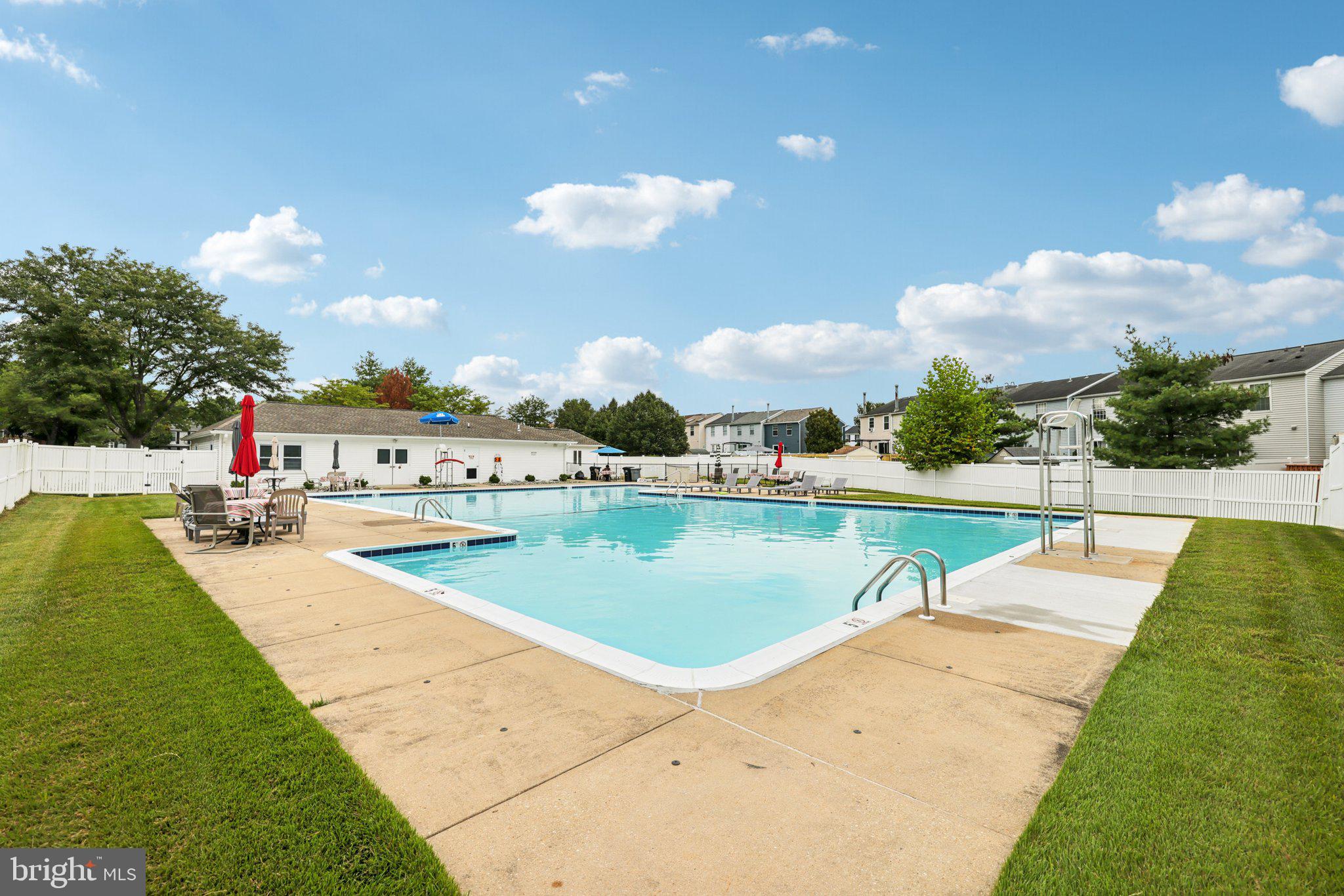 7813 Paddock Way Windsor Mill, MD 21244 - Photo 30 of 30 a view of a swimming pool with a lounge chairs