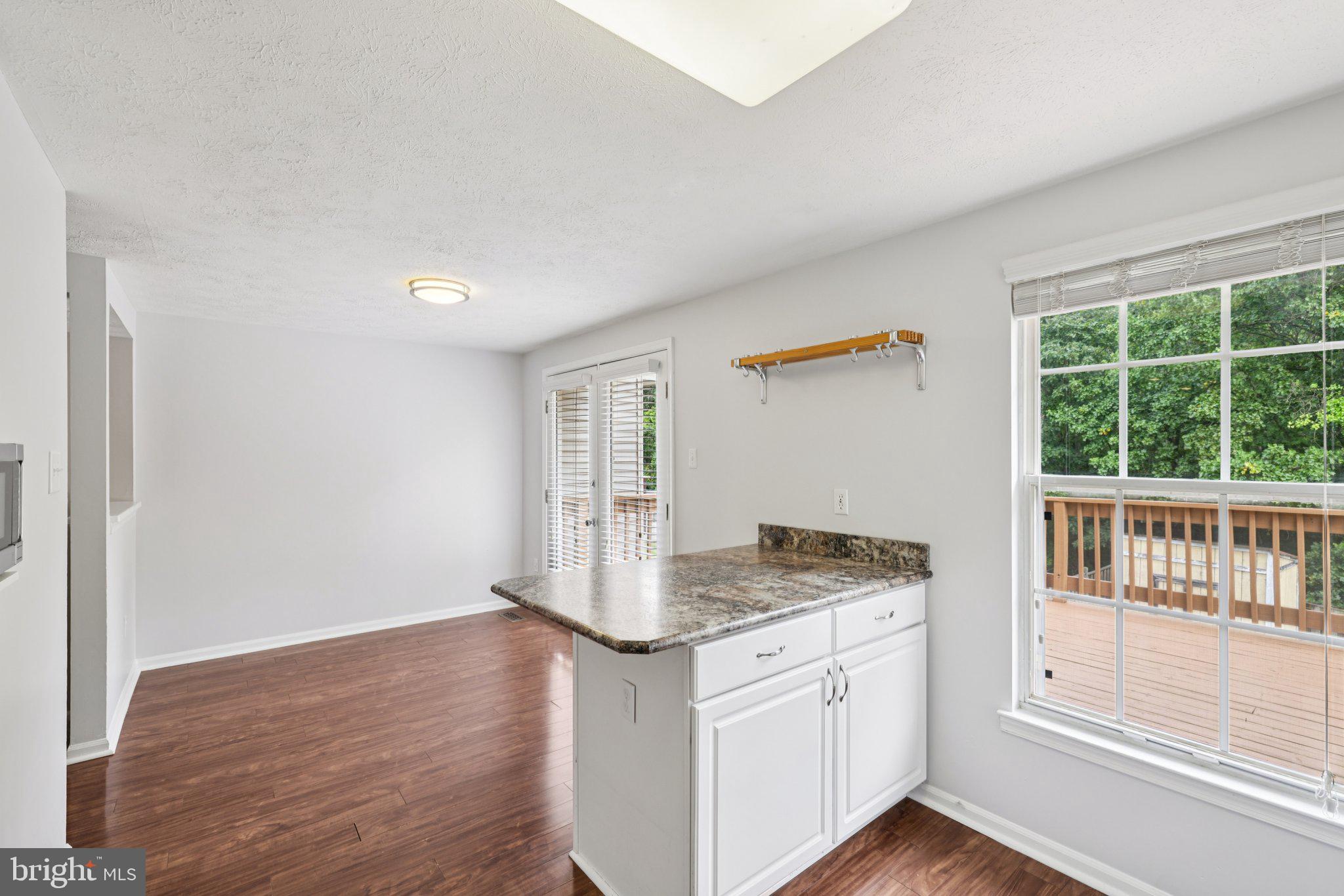 7813 Paddock Way Windsor Mill, MD 21244 - Photo 8 of 30 a kitchen with granite countertop a sink and a window