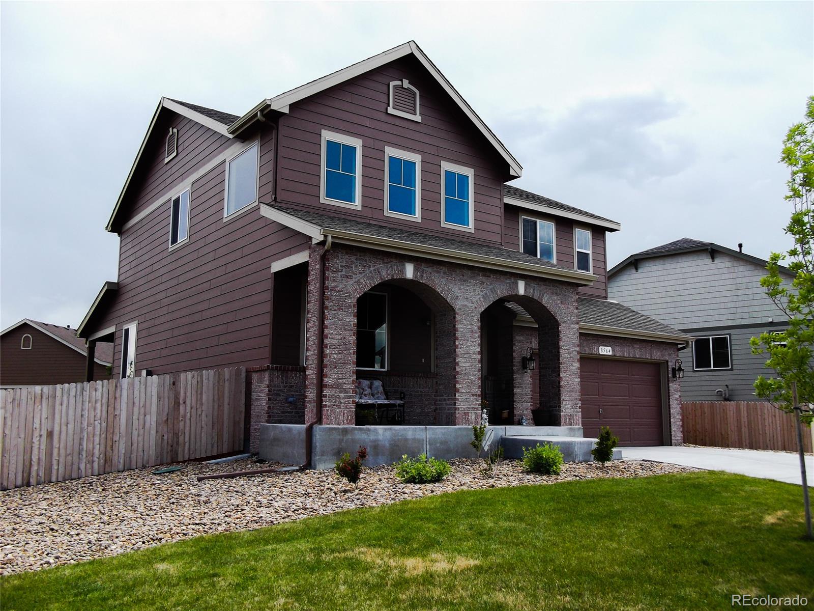 8564 Raspberry Drive Frederick, CO 80504 - Photo 1 of 1 a front view of a house with a yard and garage