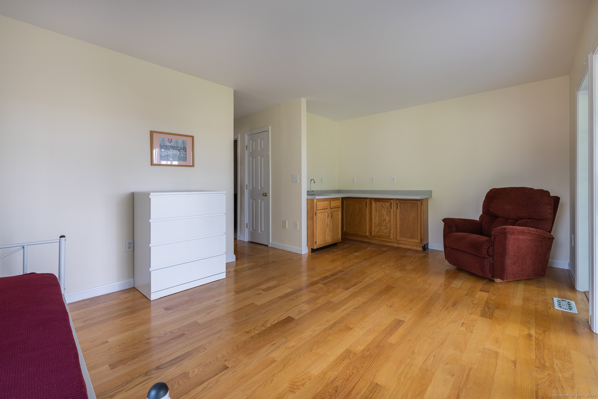 916 Reef Road Fairfield, CT 06824 - Photo 7 of 16 a view of livingroom with furniture and wooden floor